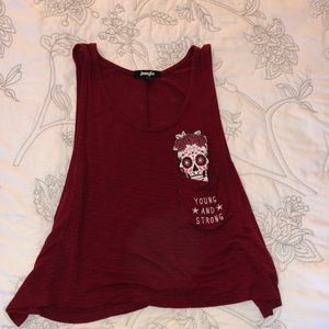 A rouge top with a front pocket